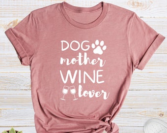 May include: A mauve t-shirt with the text "DOG mother WINE lover" and a paw print graphic.