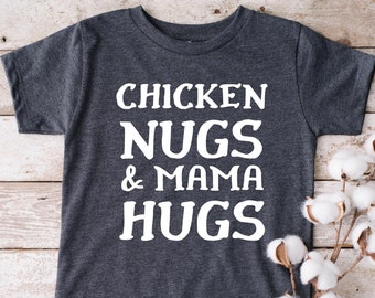 May include: A dark gray t-shirt with white text that reads "Chicken Nugs & Mama Hugs".