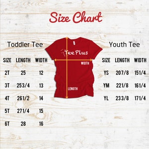Peut inclure: Tableau des tailles pour les t-shirts pour tout-petits et les t-shirts pour jeunes. Le tableau indique la taille, la longueur et la largeur en pouces pour chaque taille. Le tableau est intitul&eacute; "Toddler Tee" et "Youth Tee".