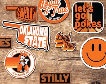 May include: A set of 20 Oklahoma State University stickers featuring various designs, including the school mascot, the state outline, and phrases like "Ride 'em Cowboys" and "Let's Go Pokes".