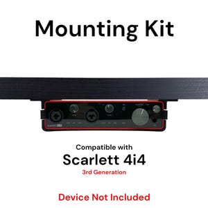 May include: A black mounting kit for a Focusrite Scarlett 4i4 3rd Generation audio interface. The kit is shown mounted to a black surface. The text "Mounting Kit" is at the top of the image. The text "Compatible with Scarlett 4i4 3rd Generation" is below the interface. The text "Device Not Included" is at the bottom of the image.