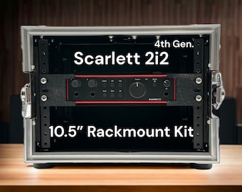 May include: A black 10.5 inch rackmount kit for a Scarlett 2i2 audio interface. The kit is made of metal and has a silver finish. The audio interface is red and black and has the text "Scarlett 2i2" and "4th Gen." printed on it.