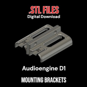 May include: A gray 3D-printed mounting bracket for Audioengine D1, with the text ".STL FILES Digital Download" at the top and "Audioengine D1 MOUNTING BRACKETS" at the bottom. The bracket has a rectangular shape with multiple openings.
