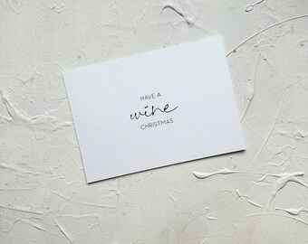 Tarjeta navideña con cita sobre vino: Have a Wine Christmas Tarjeta navideña