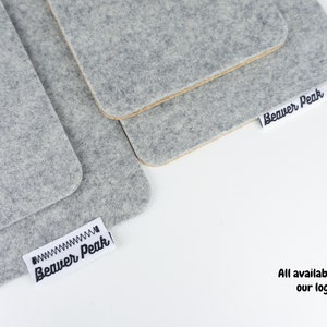 Our phone mats shown with and without logo tags on both wool plus cork and wool only options.