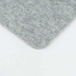 A closeup of our light grey merino wool felt that we use to make our phone pads.