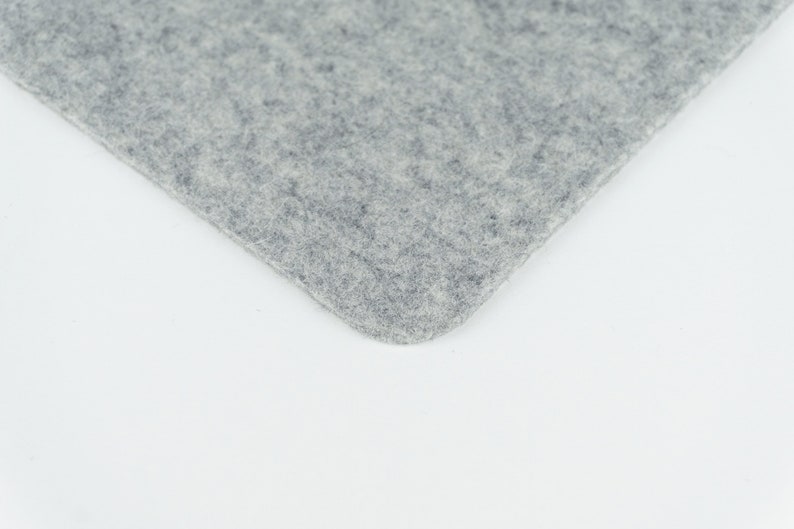 A closeup of our light grey merino wool felt that we use to make our phone pads.