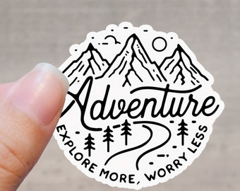 May include: Black and white sticker with a mountain range design and the text "Adventure Explore More, Worry Less".