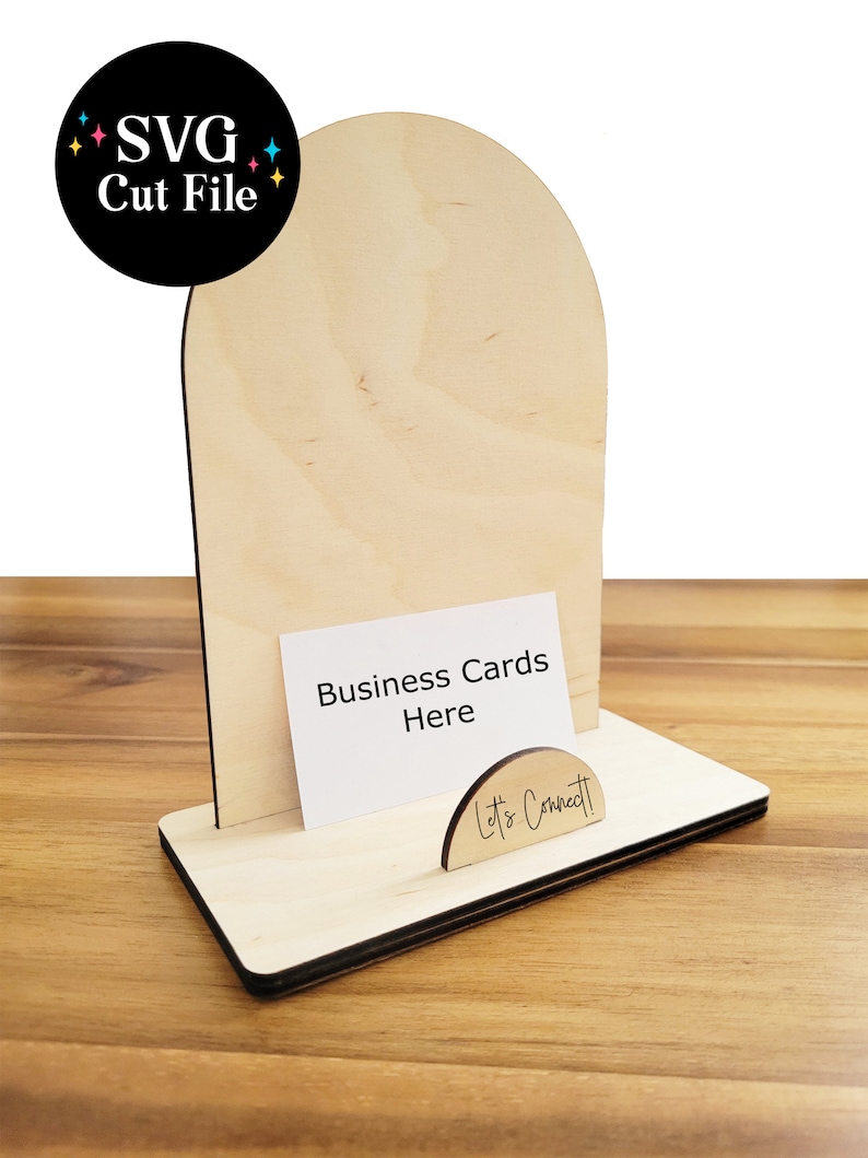 May include: Wooden business card holder with an arched top and a sign that says "Let's Connect". The holder is designed to hold business cards and has a space for a business card with the text "Business Cards Here".
