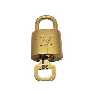 LOUIS VUITTON Polished Silver Lock and Key Set 140464