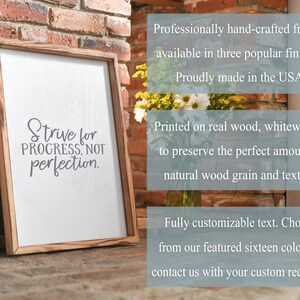 May include: Wooden sign with the text "Strive for progress, not perfection." The sign is whitewashed and has a natural wood grain. It is professionally hand-crafted and available in three finishes.