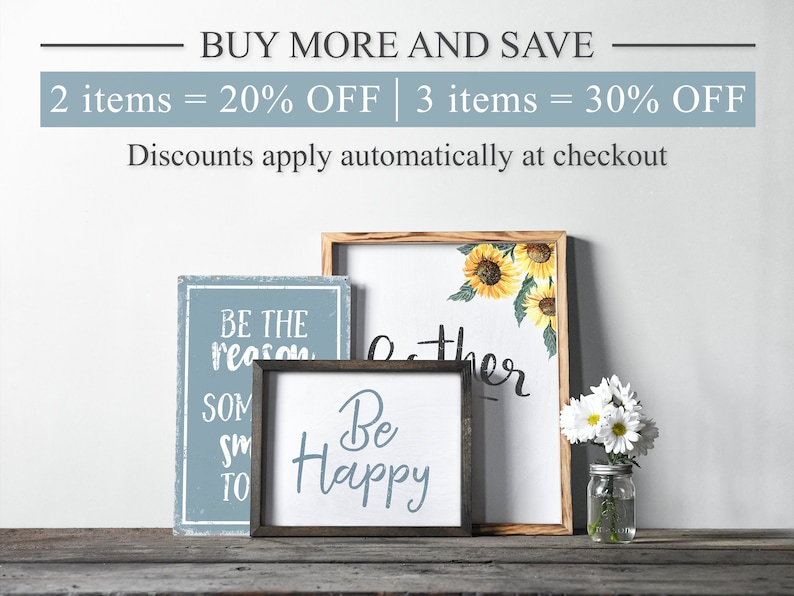 May include: Three wooden signs with inspirational messages. The signs are on a wooden surface. The signs read "Be the reason someone smiles today", "Be Happy", and "Gather".