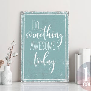 May include: A blue and white sign with the text "Do something awesome today" in a distressed font. The sign has a rustic, vintage look.