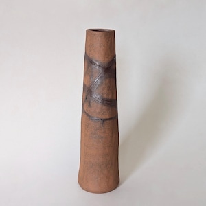 May include: A set of three ceramic mugs with a speckled, matte finish. The mugs are in shades of cream, light gray, and dark gray. Each mug has a simple, minimalist design and a rounded handle.