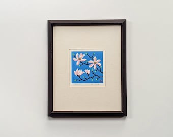 vintage japanese woodblock print | pink magnolia blossoms against blue sky | matsumi yaozo botanical artwork