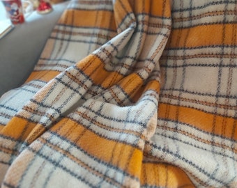 Pure wool blanket in bright orange color, soft and cosy, sensually comfy, adding style to any space, 83"/60" (210/152 cm)