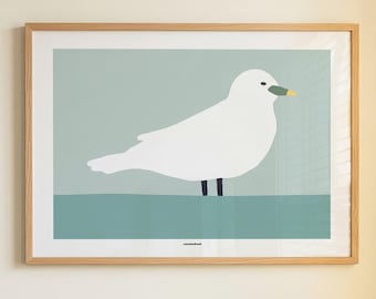 May include: A framed wall art print featuring a stylized white seagull with a yellow-tipped beak, standing on a solid teal horizontal line against a light sage green background. The print is enclosed in a light-toned wooden frame.