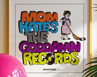 May include: A square framed print featuring the text MOM HATES THE GODDAMN RECORDS in bold, colorful lettering. An illustration of a person with a broom sweeping a vinyl record is included, along with the text camel&oasis at the bottom.