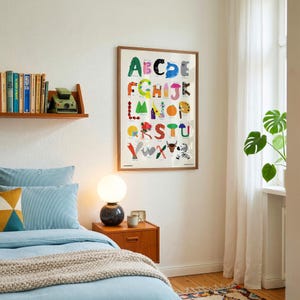 May include: A framed educational wall poster featuring a colorful alphabet design where each letter is creatively illustrated with various animals, objects, and patterns in vibrant hues, displayed in a simple wooden frame on a white wall.