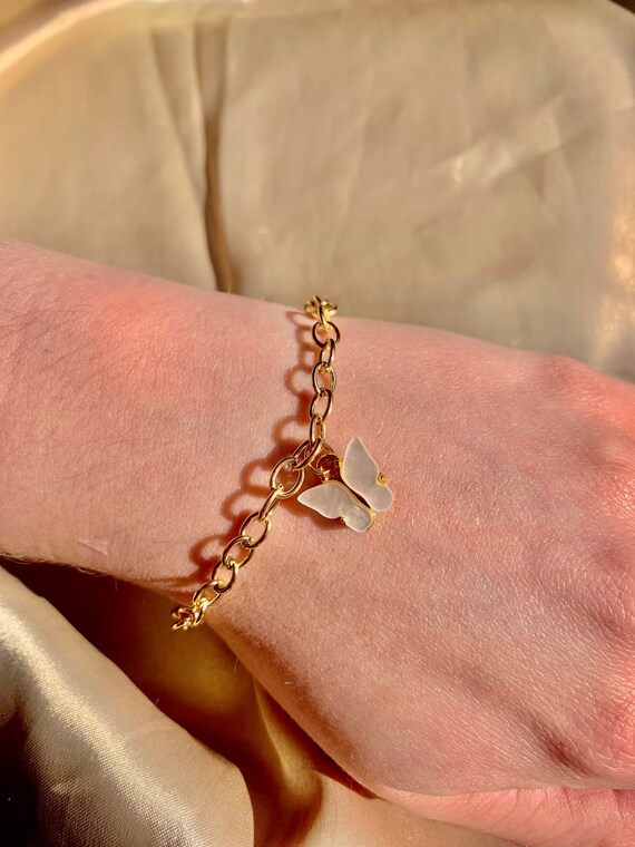 Butterfly charm bracelet gold deals