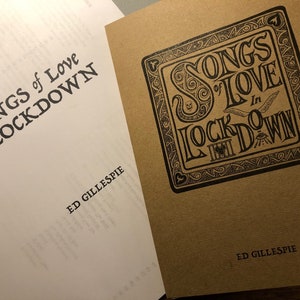 May include: Two books with the same title, "Songs of Love in Lockdown" by Ed Gillespie. The book on the left has a white cover with black text. The book on the right has a brown cover with black text and a decorative design.