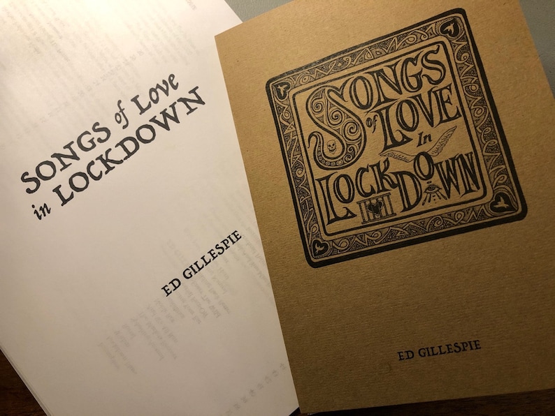 May include: Two books with the same title, "Songs of Love in Lockdown" by Ed Gillespie. The book on the left has a white cover with black text. The book on the right has a brown cover with black text and a decorative design.