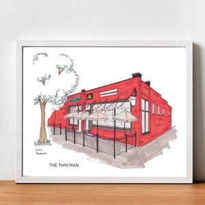 May include: A hand-drawn illustration of a red brick building with a sign that reads "The Thin Man". The building has a patio with umbrellas and string lights. There is a tree to the left of the building.
