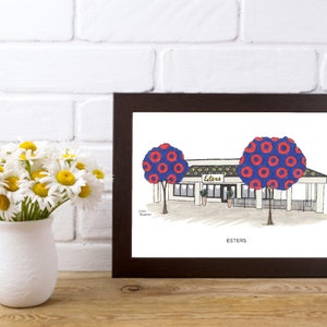May include: A framed illustration of a restaurant called "Esters" with a blue and red patterned tree on each side of the building. The text "Esters" is written below the building.