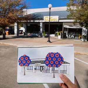 May include: Hand-drawn illustration of a building with the word "Esters" above the entrance. The building has two large trees with blue and red donut-shaped leaves. The trees are in front of the building.