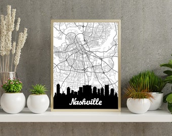 Może przedstawiać: Czarno-biały wydruk panoramy miasta z napisem "Nashville" poniżej. Wydruk jest oprawiony w złotą ramę i wisi na szarej ścianie.