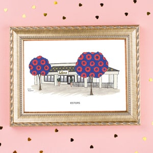 May include: A framed illustration of a restaurant called "Esters" with a blue and red donut pattern on the trees. The text "Esters" is written below the illustration.