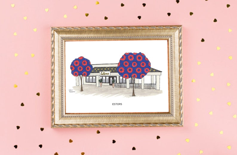 May include: A framed illustration of a restaurant called "Esters" with a blue and red donut pattern on the trees. The text "Esters" is written below the illustration.
