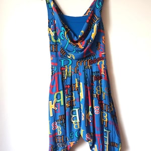 Retro Harem Jumpsuit S/M – 80s Style Drop Crotch – Soft Blue with Multicolour Letter Print – Below Knee Fit – Vintage Vibes