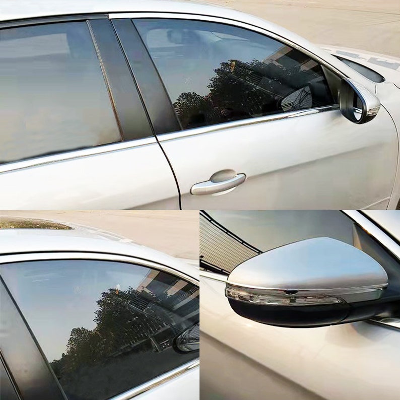 May include: A white car with tinted windows and chrome accents. The car has a side view mirror with a chrome trim. The car is parked on a paved surface.