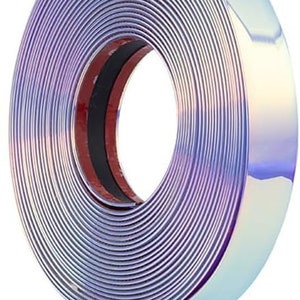 May include: A roll of iridescent blue trim tape with a red adhesive backing. The tape is rolled up and the adhesive side is facing the camera.