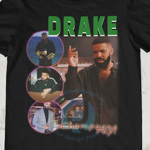 May include: Black t-shirt with a collage of images of Drake, the text "DRAKE" in green, and the text "Champagne Papi" in pink and blue.
