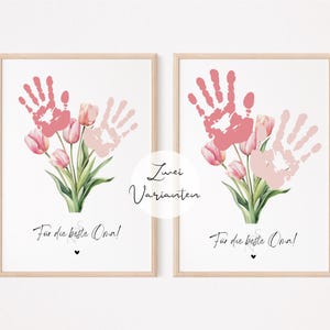 May include: Two printable art prints with handprints and pink tulips. The text on the prints reads "Zwei Varianten" and "For the best Oma!"