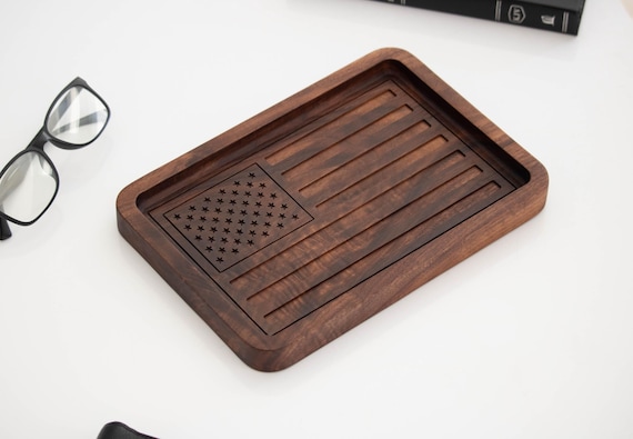 An American flag inlaid into a solid walnut valet tray — 223 favorites don't lie, this is a legitimately beautiful patriotic desk/nightstand piece with real woodworking craft.