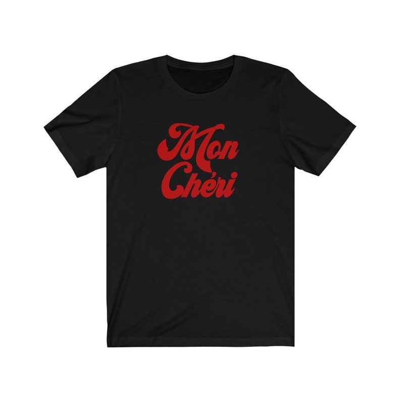 May include: Black t-shirt with a red graphic that says "Mon Ch&eacute;ri" in a retro font.