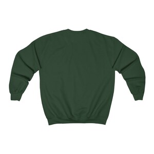 May include: A dark green sweatshirt with long sleeves and a crew neck.