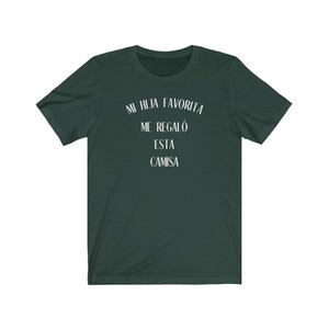 May include: A dark green t-shirt with white text that reads "Mi hija favorita me regal&oacute; esta camisa".