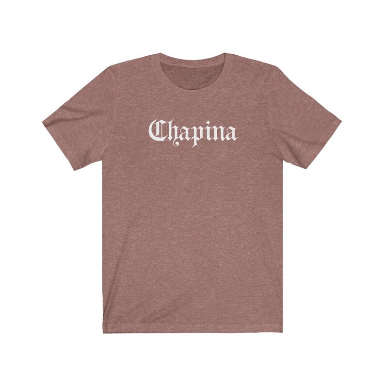 May include: A heather gray t-shirt with the word "Chapina" printed in white on the front.