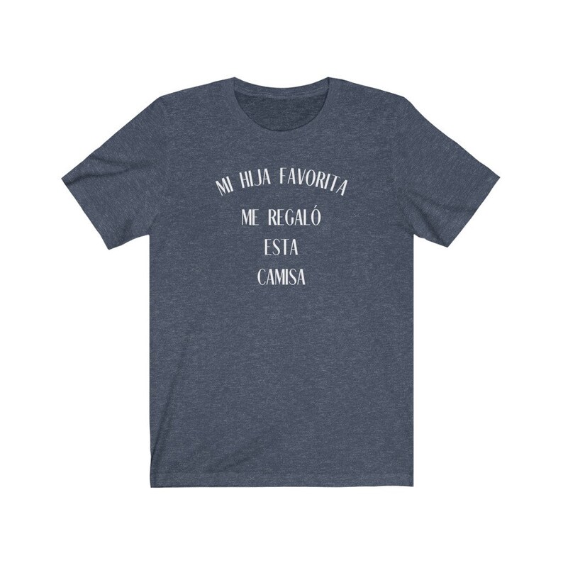 May include: A dark blue t-shirt with white text that reads "Mi hija favorita me regal&oacute; esta camisa".