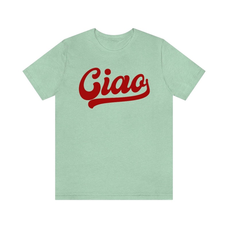 May include: A light green t-shirt with a red retro-style graphic that says "Ciao".