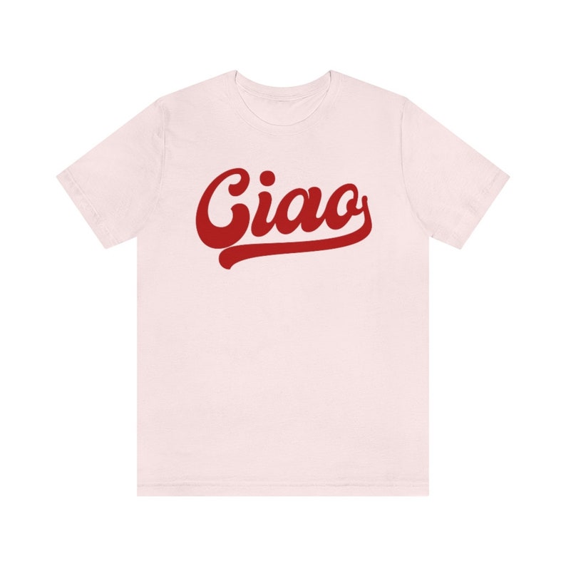 May include: A pink t-shirt with the word "Ciao" in red, stylized lettering.