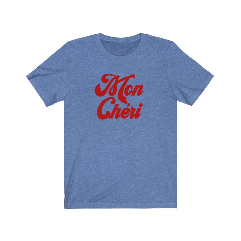 May include: A blue t-shirt with the text "Mon Ch&eacute;ri" in red, retro-style lettering.