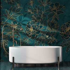 May include: A white freestanding bathtub with gold-toned legs sits in front of a teal green wall with a gold floral pattern.
