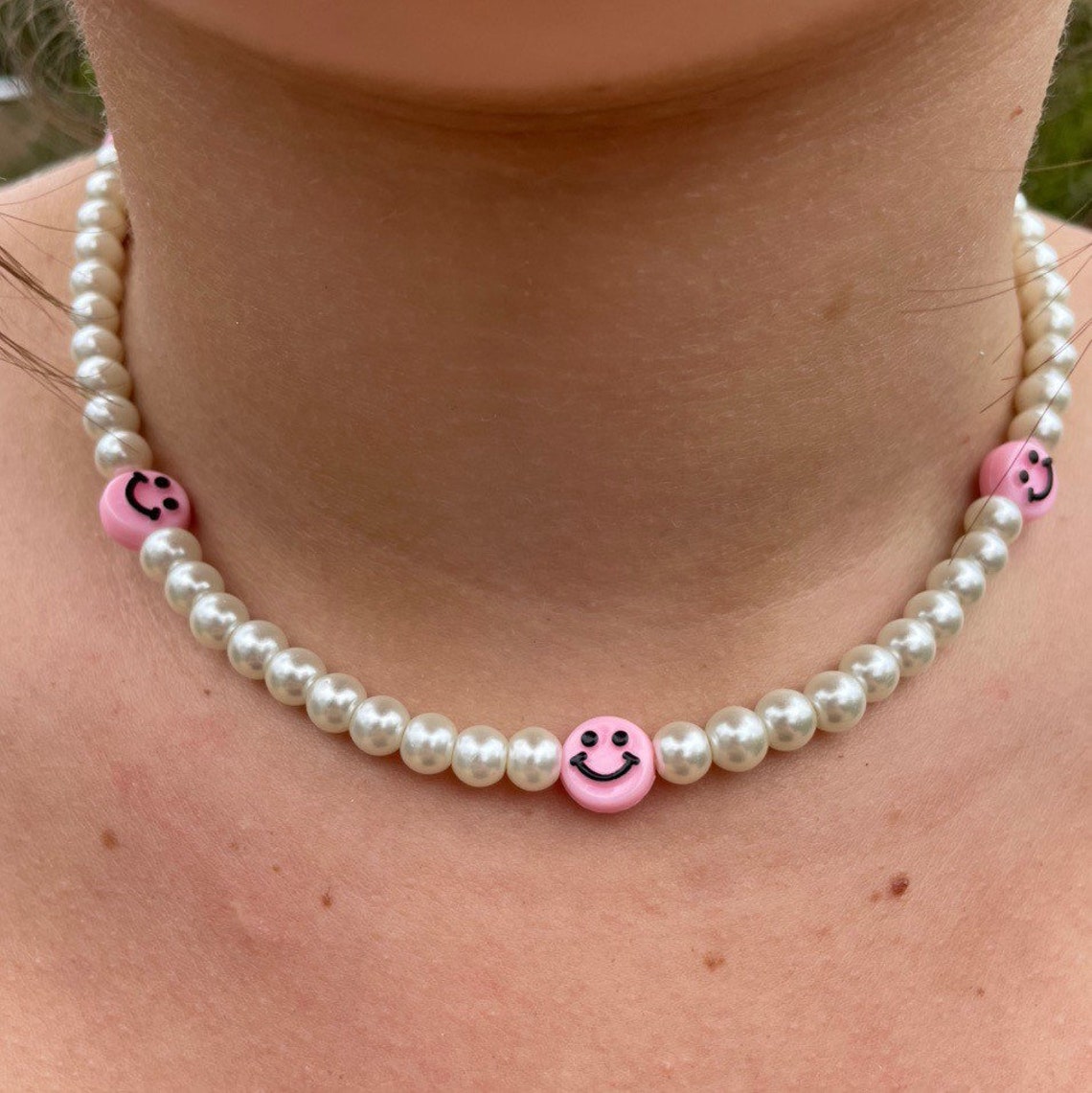 Smiley face pearl necklace