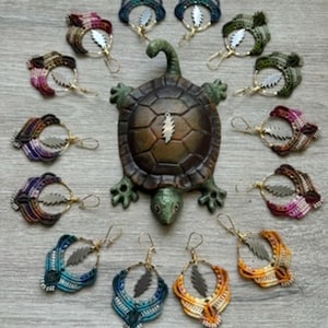 13 point bolt stealie earrings.           Available in 1”gold or 1 1/4” silver hoops available in a rainbow of colors
