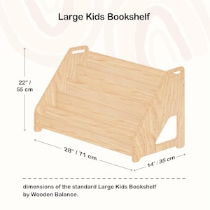 May include: A light-colored wooden bookshelf for kids, with three shelves and a sloped design. The bookshelf is 28 inches (71 cm) wide, 22 inches (55 cm) tall, and 14 inches (35 cm) deep. The text "Large Kids Bookshelf" is at the top.